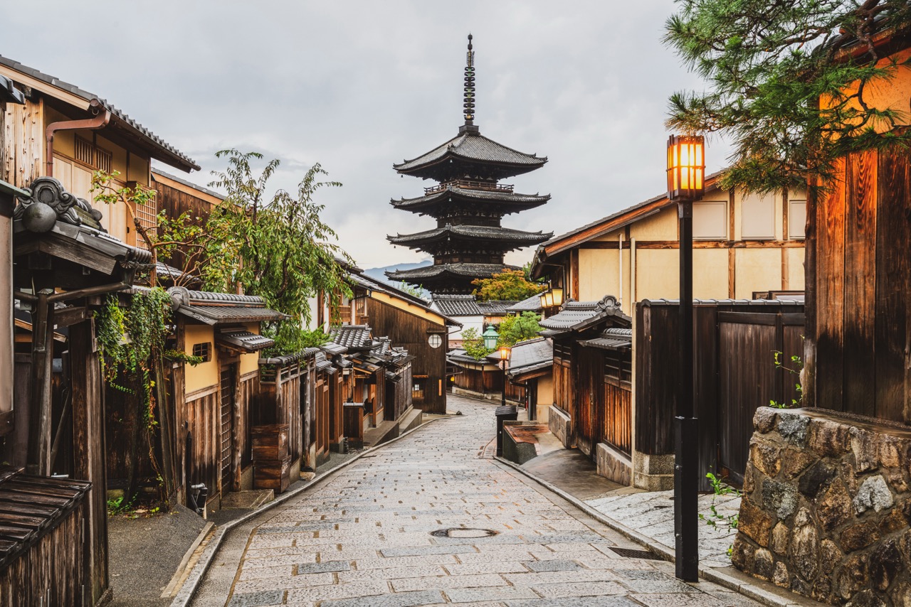 (Multiple Values) Historic Japanese street with wooden buildings and pagoda temple in background