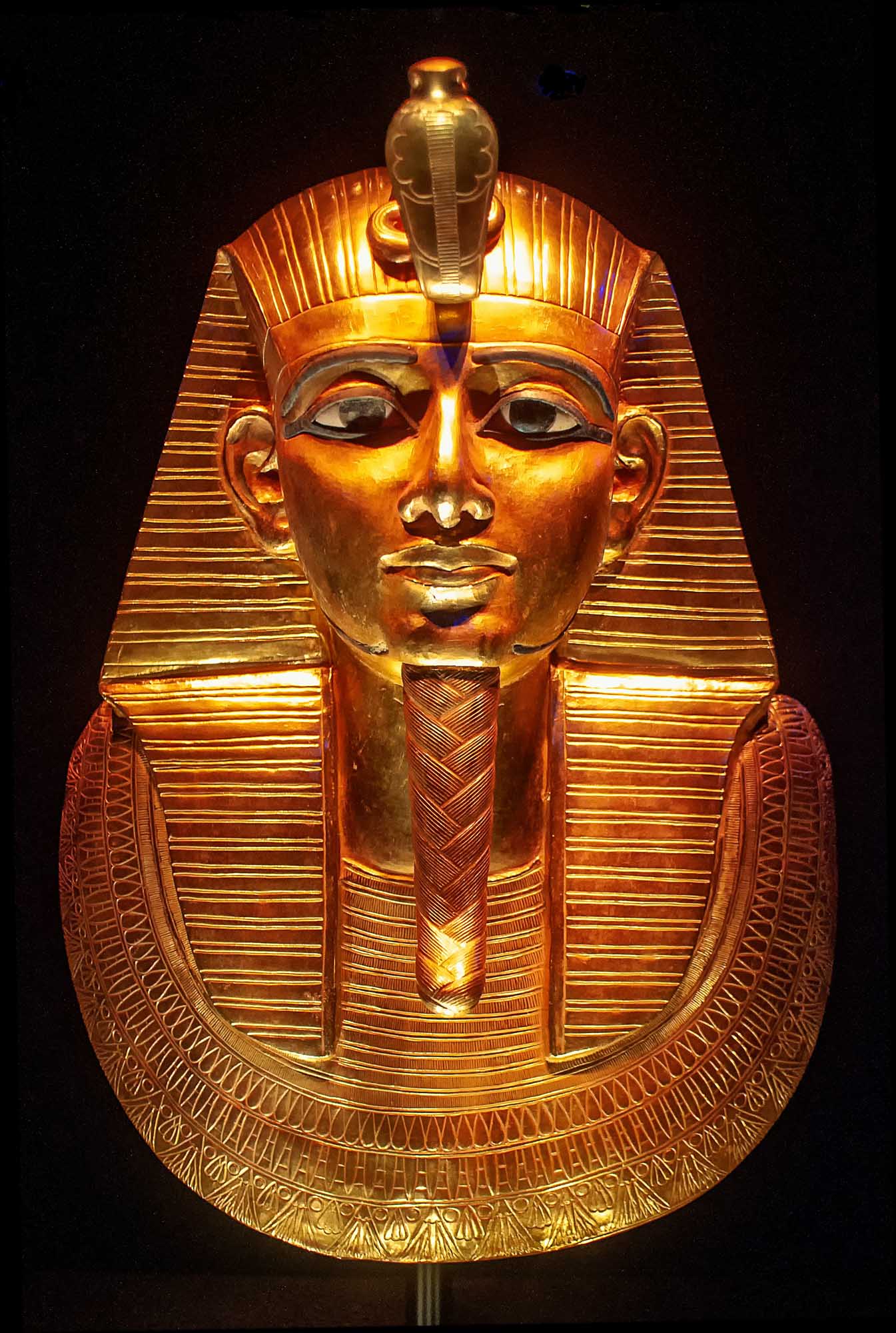 Golden Pharaoh Tutankhamun Funerary Mask A magnificent golden funerary mask of ancient Egyptian Pharaoh Tutankhamun, displayed against